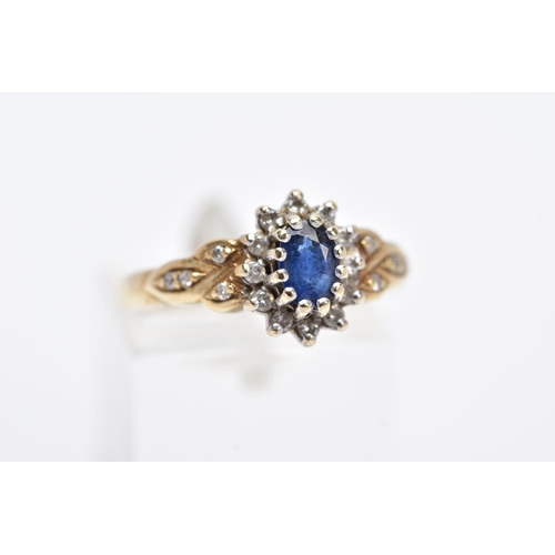 1 - A 9CT GOLD SAPPHIRE AND DIAMOND CLUSTER RING, designed with a central claw set oval cut blue sapphir... 