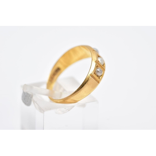 106 - A YELLOW METAL CULTURED PEARL RING, designed with a five square section, three set with cultured spl... 