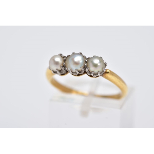 109 - A LATE 19TH EARLY 20TH CENTURY THREE PEARL RING, yellow gold ring designed with three claw set, grad... 