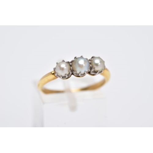 109 - A LATE 19TH EARLY 20TH CENTURY THREE PEARL RING, yellow gold ring designed with three claw set, grad... 