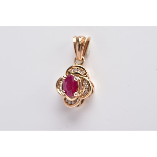 11 - A 9CT GOLD RUBY AND DIAMOND PENDANT, centring on an oval cut ruby (possibly treated/synthetic), with... 