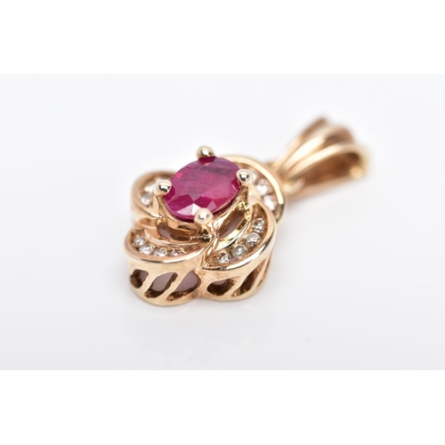 11 - A 9CT GOLD RUBY AND DIAMOND PENDANT, centring on an oval cut ruby (possibly treated/synthetic), with... 