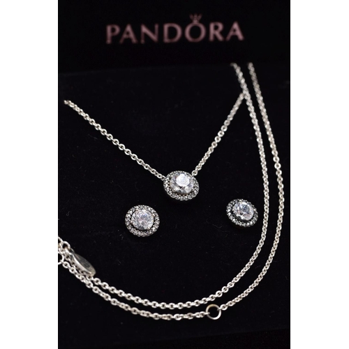 113 - A PANDORA NECKLACE AND EARRING GIFT SET, the necklace designed with a cubic zirconia halo set pendan... 