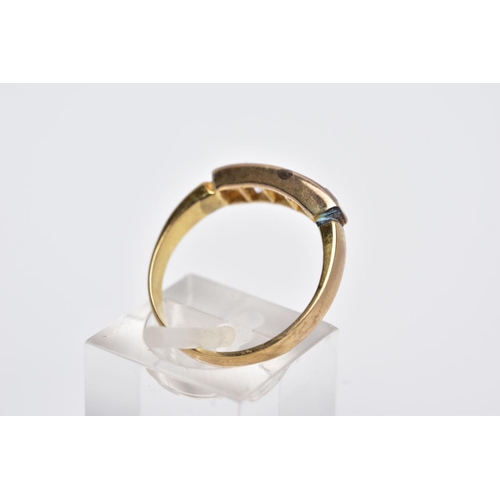 12 - A YELLOW METAL HALF HOOP RING, designed with a row of graduated square cut colourless stones, assess... 