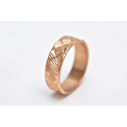 121 - A 9CT GOLD WIDE BAND, textured band, approximate width 5.9mm, hallmarked 9ct gold, engraved to the i... 