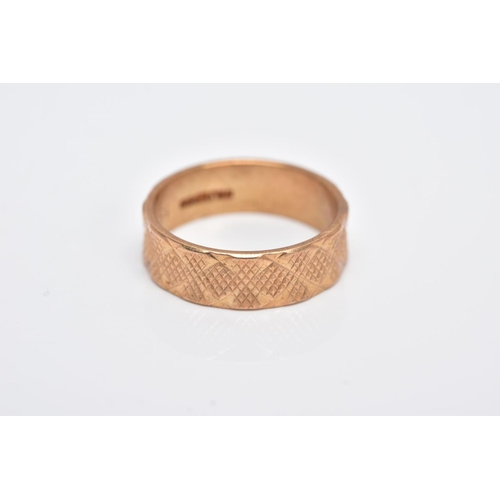 121 - A 9CT GOLD WIDE BAND, textured band, approximate width 5.9mm, hallmarked 9ct gold, engraved to the i... 