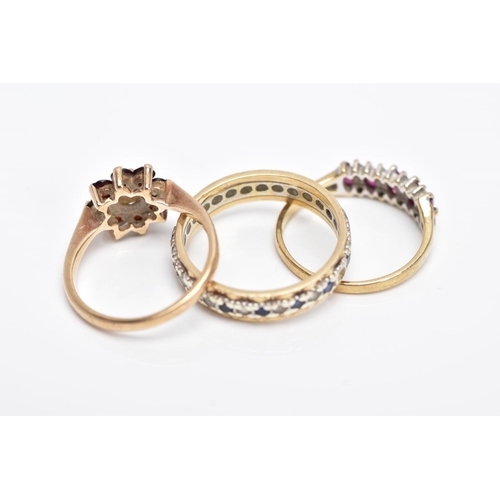 123 - THREE 9CT GOLD GEM SET RINGS, to include a full eternity ring set with colourless spinel and blue sa... 