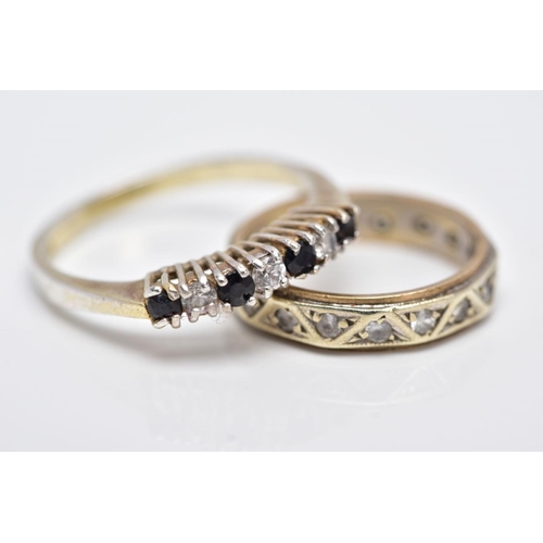 125 - A YELLOW METAL FULL ETERNITY RING AND A SILVER GEM SET RING, the full eternity ring set with colourl... 