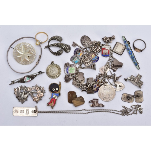 129 - A BAG OF ASSORTED JEWELLERY, to include a white metal charm bracelet, suspending thirty-two white me... 