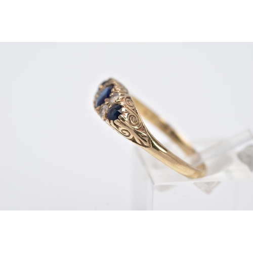 133 - A 9CT GOLD SAPPPHIRE AND PASTE RING, centring on an oval cut blue sapphire flanked with colourless p... 