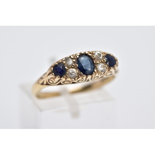 133 - A 9CT GOLD SAPPPHIRE AND PASTE RING, centring on an oval cut blue sapphire flanked with colourless p... 