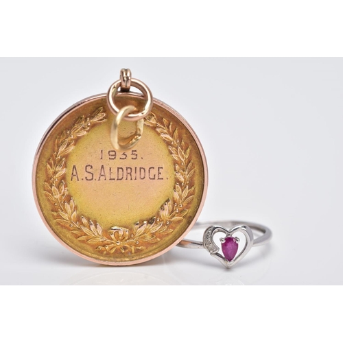 134 - A 9CT GOLD MOUNTED MEDAL AND A 9CT WHITE GOLD RUBY AND DIAMOND RING, the medal of a circular form, i... 