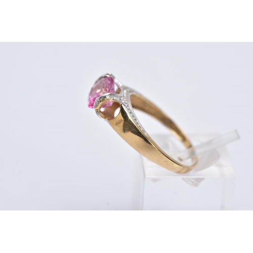 162 - A 9CT GOLD PINK TOPAZ RING, designed with a tension set, oval cut pink topaz, single cut diamond det... 