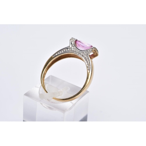 162 - A 9CT GOLD PINK TOPAZ RING, designed with a tension set, oval cut pink topaz, single cut diamond det... 