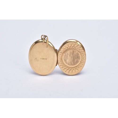 164 - A 9CT GOLD OVAL LOCKET PENDANT, textured design with a vacant cartouche, fitted with a tapered groov... 