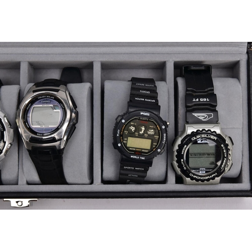 182 - A WATCH DISPLAY CASE WITH DIGITAL WRISTWATCHES, black and glass panelled display case with six watch... 