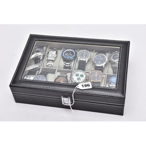 186 - A WATCH DISPLAY CASE WITH WATCHES, a black and glass panelled watch display case, with twelve gents ... 