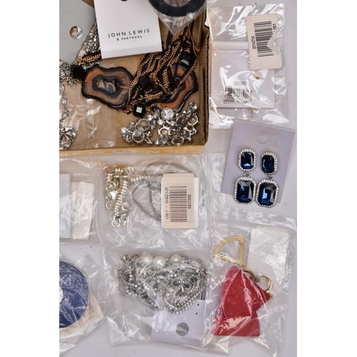 189 - A TRAY OF COSTUME JEWELLERY, some pieces with tags and packaging, to include a large resin hoop neck... 