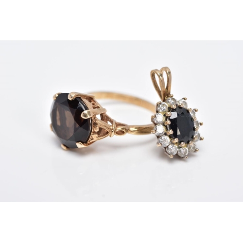 19 - A 9CT GOLD SMOKEY QUARTZ RING AND A 9CT GOLD SAPPHIRE PENDANT, the ring designed with a claw set, ci... 