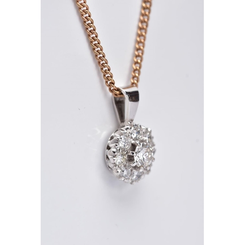 195 - A LATE 20TH CENTURY ROUND DIAMOND CLUSTER PENDANT AND CHAIN, centring on a modern round brilliant cu... 