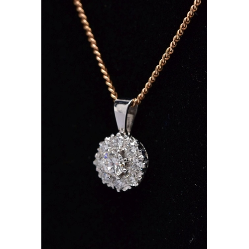 195 - A LATE 20TH CENTURY ROUND DIAMOND CLUSTER PENDANT AND CHAIN, centring on a modern round brilliant cu... 