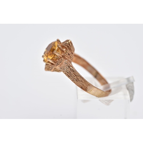 199 - A 9CT GOLD SINGLE STONE CITRINE RING, a round mixed cut citrine measuring approximately 8.0mm in dia... 