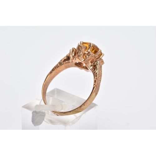 199 - A 9CT GOLD SINGLE STONE CITRINE RING, a round mixed cut citrine measuring approximately 8.0mm in dia... 