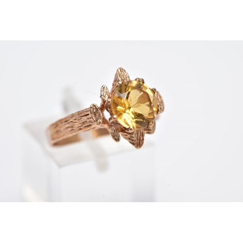 199 - A 9CT GOLD SINGLE STONE CITRINE RING, a round mixed cut citrine measuring approximately 8.0mm in dia... 