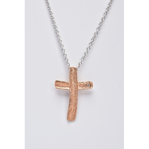 209 - A MODERN 18CT ROSE GOLD DIAMOND SET CROSS AND WHITE GOLD CHAIN, a small textures rose gold cross wit... 