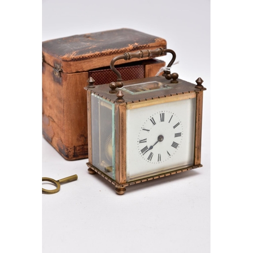 211 - A SMALL LEATHER CASED BRASS TRAVEL CARRIAGE CLOCK, glass panels, white dial with roman numerals, mec... 