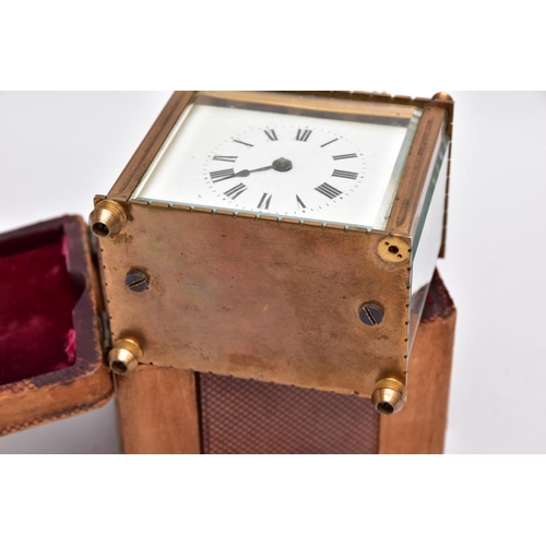 211 - A SMALL LEATHER CASED BRASS TRAVEL CARRIAGE CLOCK, glass panels, white dial with roman numerals, mec... 