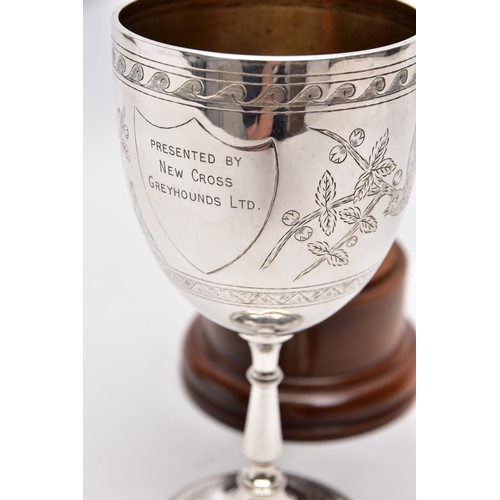 217 - A LATE VICTORIAN SILVER TROPHY CUP, engraved foliate and bird design, engraved inscription 'Presente... 