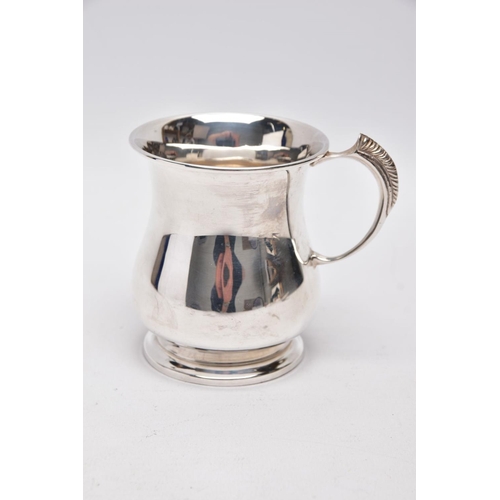 218 - A SILVER TANKARD, bell shaped body with a feather detailed handle, hallmarked 'Roberts & Dore' Birmi... 