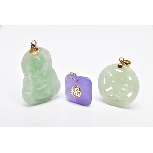 26 - THREE JADE PENDANTS, the first a carved Buddha, fitted with a tapered bail, stamped '14k', the secon... 