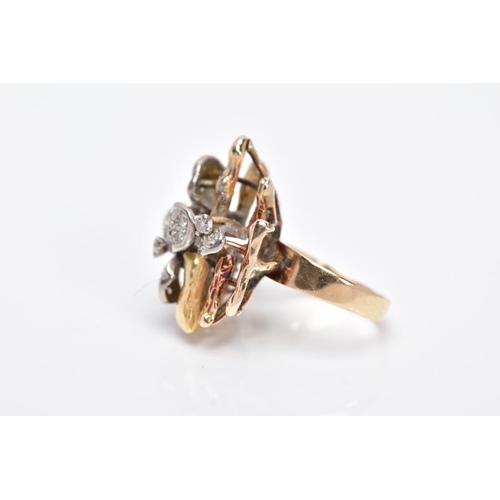 30 - A YELLOW METAL DIAMOND SET RING, of a floral and bark textured design in the style of Andrew Grima, ... 