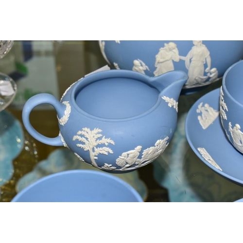 362 - A SMALL COLLECTION OF WEDGWOOD PALE BLUE JASPERWARE, comprising a tea pot and cover and flattened ci... 