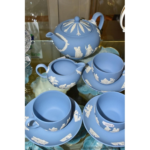 362 - A SMALL COLLECTION OF WEDGWOOD PALE BLUE JASPERWARE, comprising a tea pot and cover and flattened ci... 