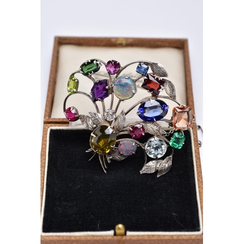 38 - A WHITE METAL FLORAL SPRAY, GEM SET BROOCH, floral spray set with a variety of multi cut gemstones s... 