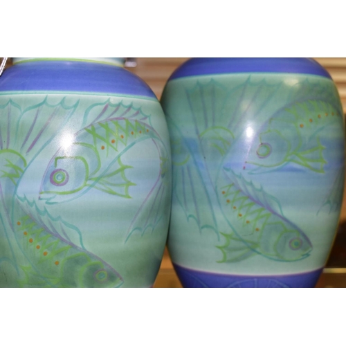 384 - A POOLE STUDIO SALLY TUFFIN BALUSTER VASE AND MATCHING JAR, the baluster vase handpainted with bands... 