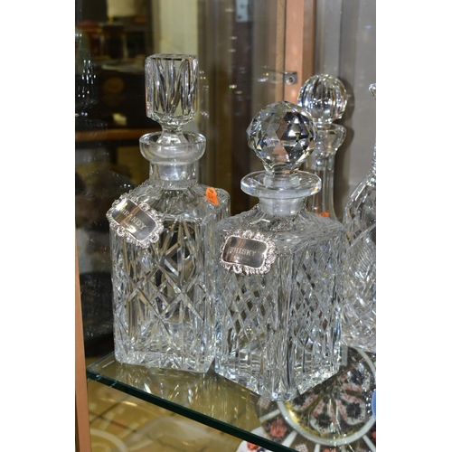 388 - FOUR CUT GLASS DECANTERS, comprising a Waterford ships decanter and stopper and a Waterford mallet s... 