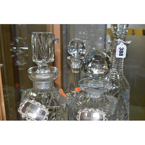 388 - FOUR CUT GLASS DECANTERS, comprising a Waterford ships decanter and stopper and a Waterford mallet s... 