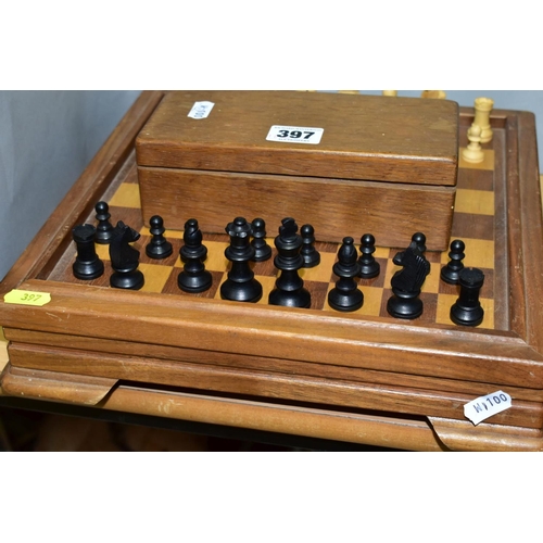 397 - A MID 20TH CENTURY WOODEN CHESS BOARD AND CHESS PIECES, the board with lift off top opening to revea... 