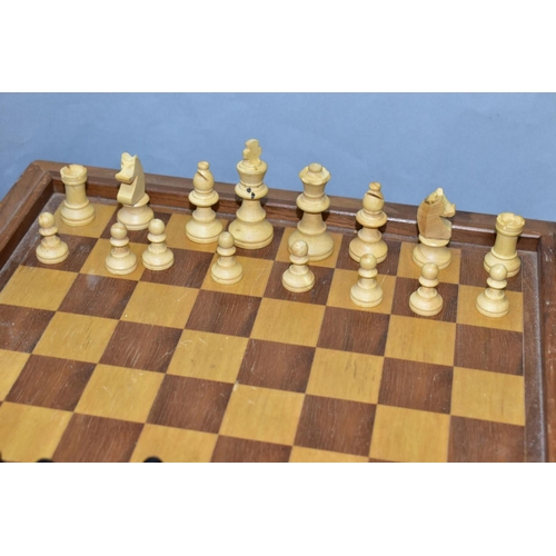 397 - A MID 20TH CENTURY WOODEN CHESS BOARD AND CHESS PIECES, the board with lift off top opening to revea... 