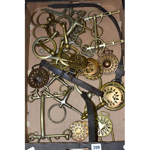 399 - A BOX OF HEAVY HORSE TACK AND HORSE BRASSES, including a halter with brass bit attached and decorati... 