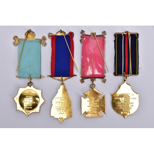 41 - FOUR SILVER GILT, MASONIC MEDALS, of various designs decorated with blue, red, green and white ename... 