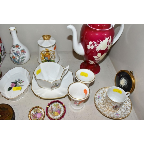 439 - A GROUP OF CERAMIC FIGURES AND ORNAMENTS, including Capo Di Monte tramp on a bench, elderly couple, ... 