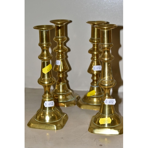 445 - SIX NEAR PAIRS OF BRASS CANDLESTICKS, tallest height 21.5cm (12)