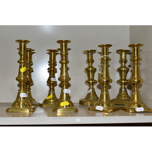 445 - SIX NEAR PAIRS OF BRASS CANDLESTICKS, tallest height 21.5cm (12)