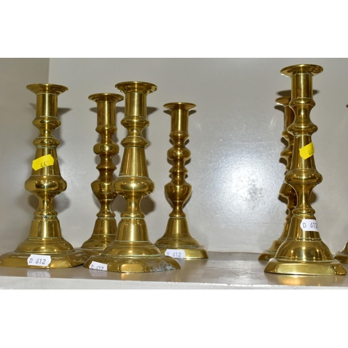 445 - SIX NEAR PAIRS OF BRASS CANDLESTICKS, tallest height 21.5cm (12)