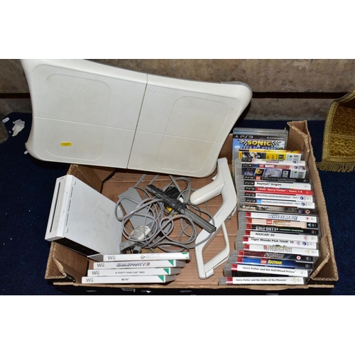 452 - A BOX OF GAMING ITEMS, to include Wii console and Wii fit  board and game, various other games (acti... 